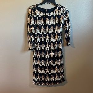 Sequin dress for a fun night out. Black and gold shades, mid length sleeves